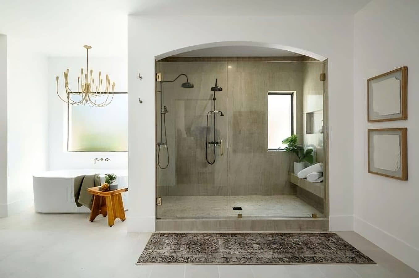 Spa-inspired master bath with freestanding soaking tub and chandelier